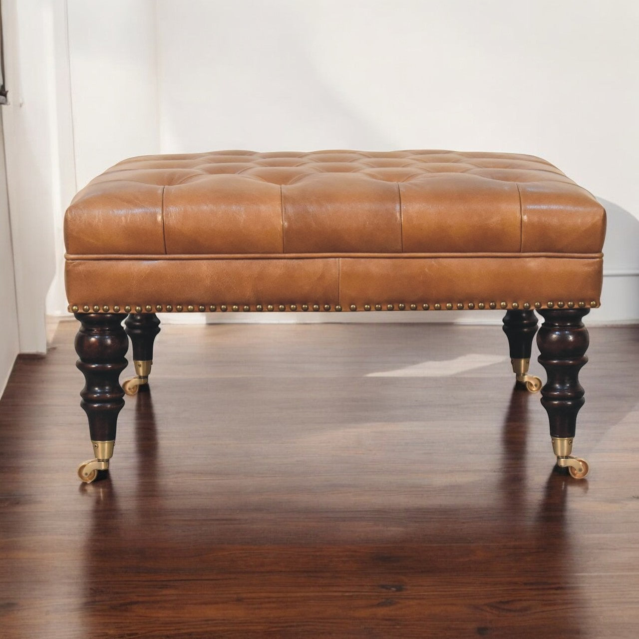 Studded Buffalo Tan Leather Ottoman with Castor Legs